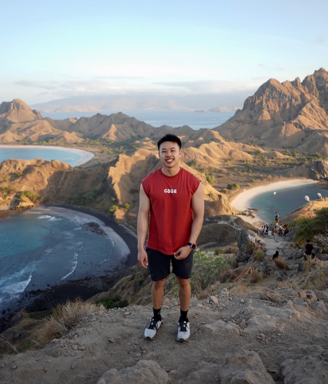Andy standing above a rugged island coastline